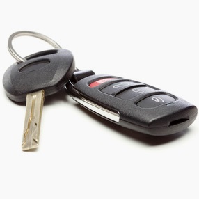 Transponder key being programmed during locksmith car key replacement in Austin, TX.