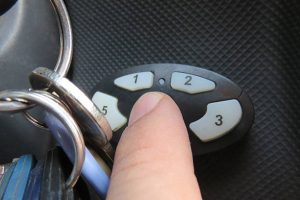 Car key code retrieval service being performed by a locksmith.