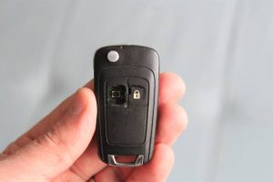 Car key Fob with missing button being fixed by a car key replacement locksmith in Austin, TX.